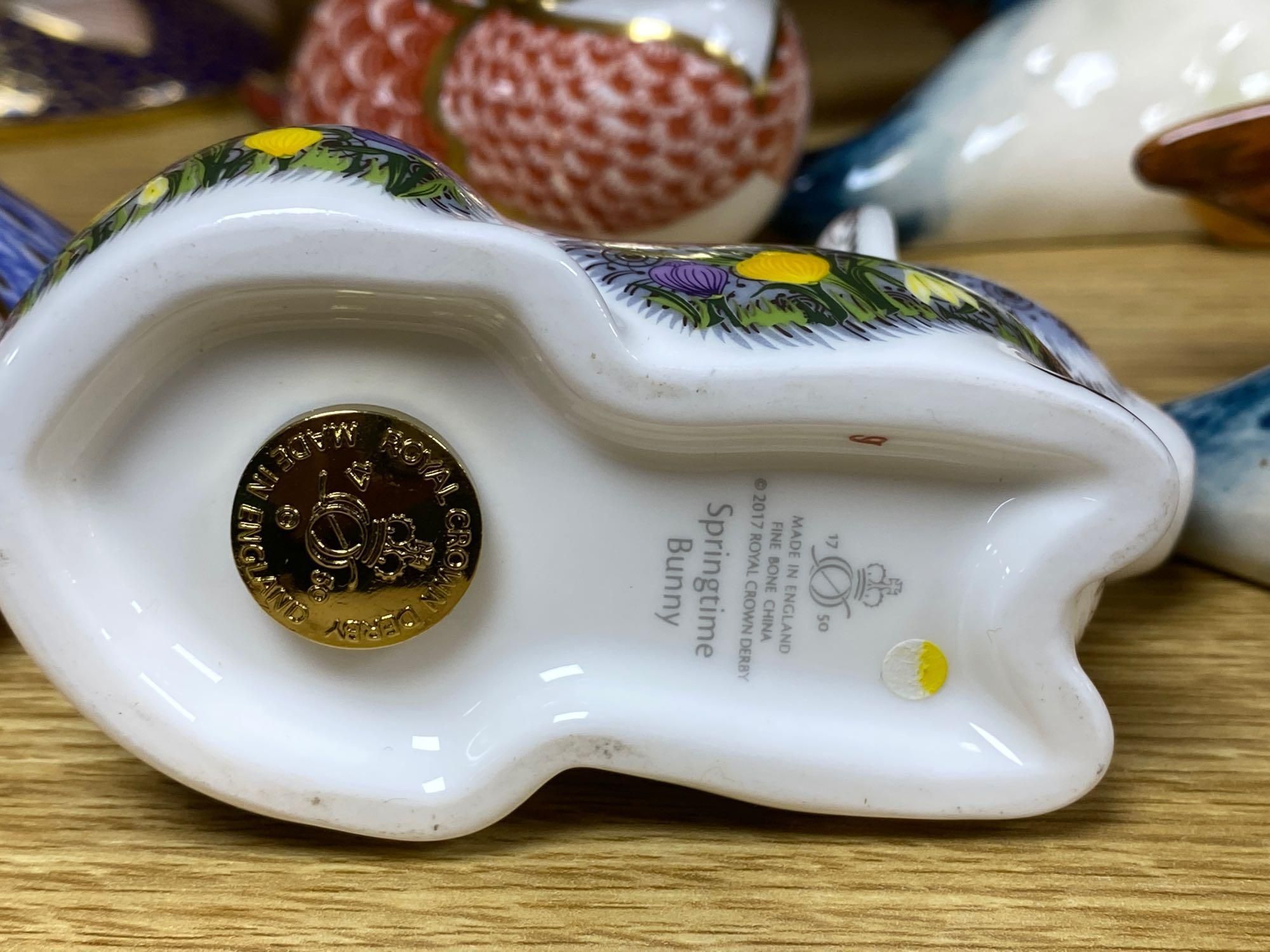 A graduated set of Beswick flying ducks and five Royal Crown Derby animal paperweights and another similar rabbit, fish 18cm